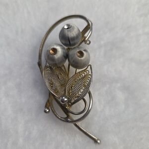 Elegant Silver and Gold Floral Brooch